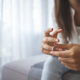 Unhappy woman holding wedding ring close up, upset girl crying, depressed with divorce, break up with boyfriend, broken engagement, feeling desperate, family split, bad relationships