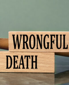 WRONGFUL DEATH - words on wooden blocks with a judge's gavel in the background