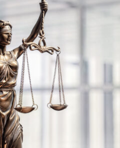 Legal and law concept statue of Lady Justice with scales of justice and office background