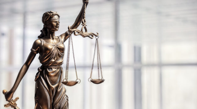 Legal and law concept statue of Lady Justice with scales of justice and office background