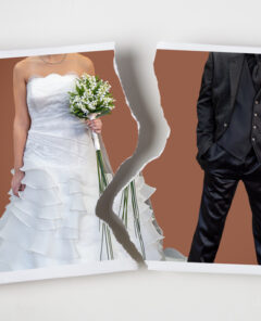 Divorce concept. Torn photograph of a couple at their wedding with red background